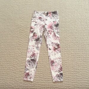 Athleta Salutation Stash Pocket Peony 7/8 floral leggings.